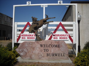 Cowboy Hang-time Statue with Historic Rodeo Bucking Chute Gates -- Downtown Burwell